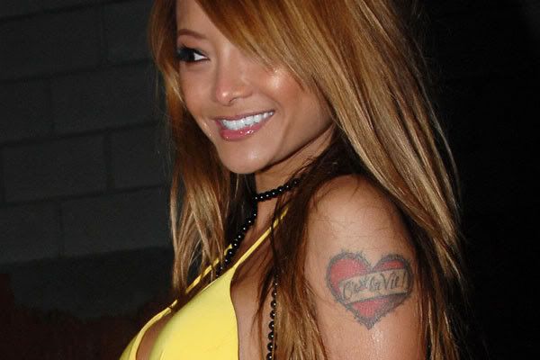 Reality personality Tila Tequila has a barbed wired heart tattooed on her 